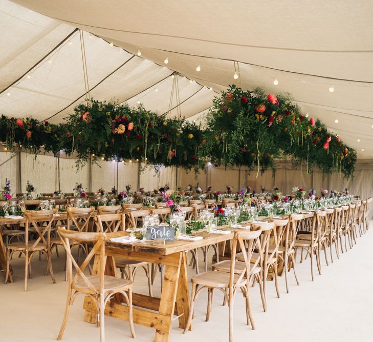 Beautiful marquee wedding with hanging flower installations