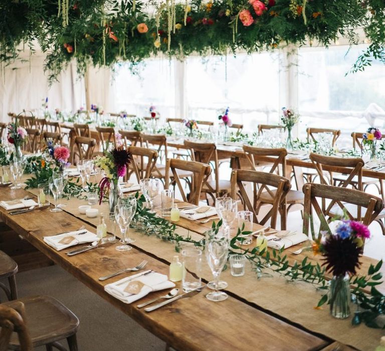 Beautiful marquee wedding with hanging flower installations