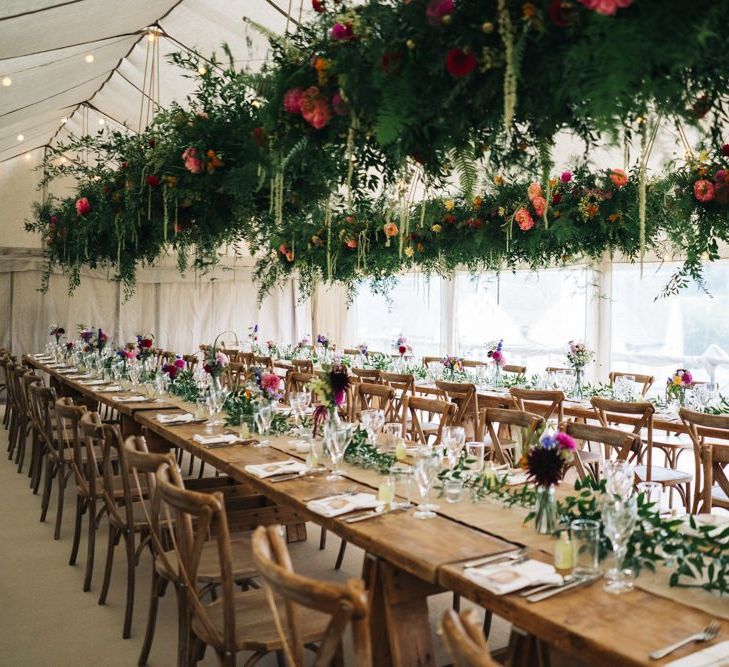 Beautiful marquee wedding with hanging flower installations