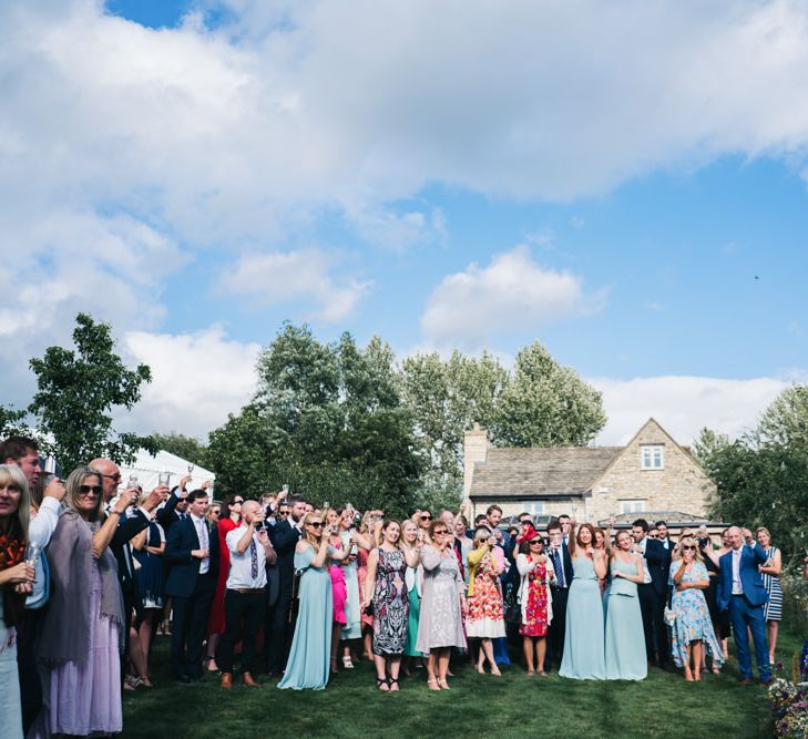 Wedding guests listen to the wedding speeches