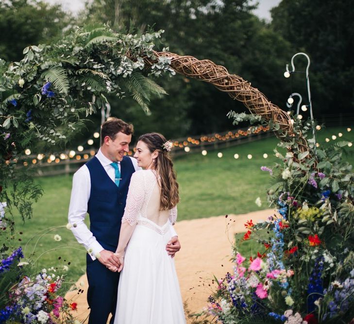 Wildflower moon gate arch at garden wedding