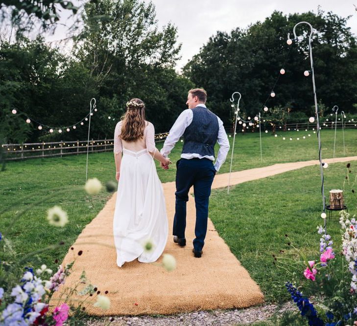 Wildflower moon gate arch with festoon lighting