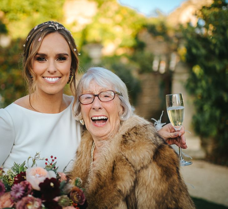 Bride in Pronovias Wedding Dress and Nan in Faux Fur Jacket