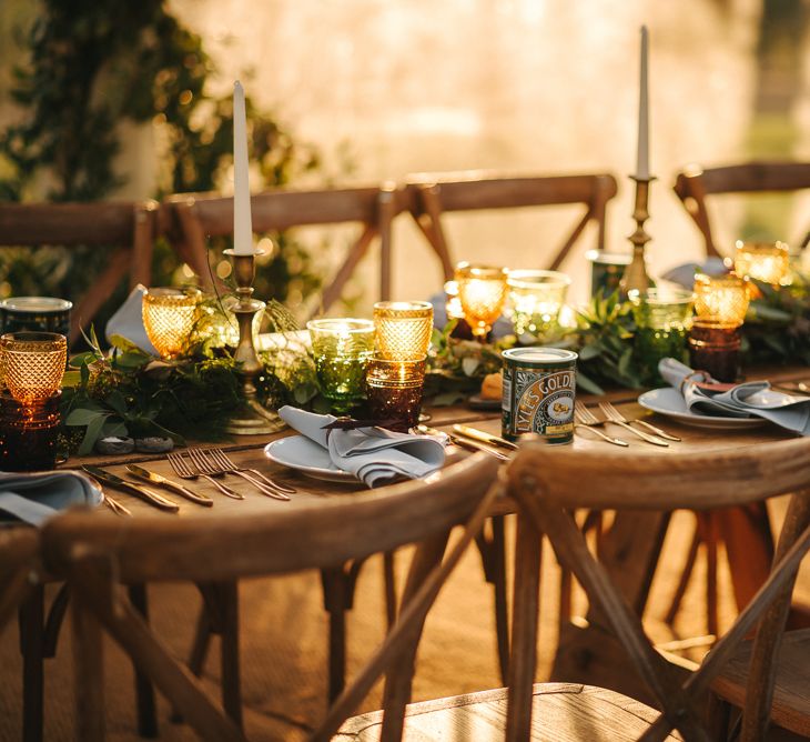 Rustic Wedding Reception Decor with Wooden Chairs , Foliage Table Runner and Yellow Goblets