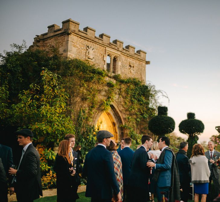 Wedding Guests Gathered in The Gardens of  The Lost Orangery at Euridge Manor