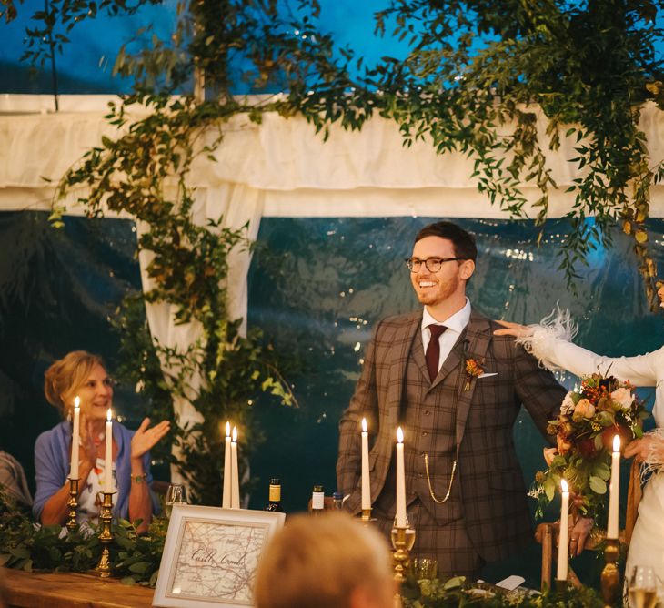 Bride and Groom Laughing During Wedding Reception Speeches