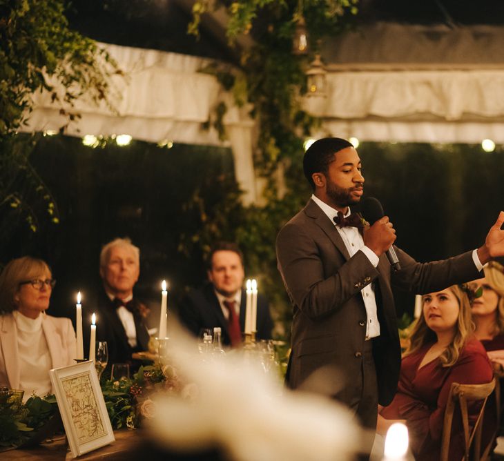 Best Man Giving His Speech During The Candle Lit Wedding Reception