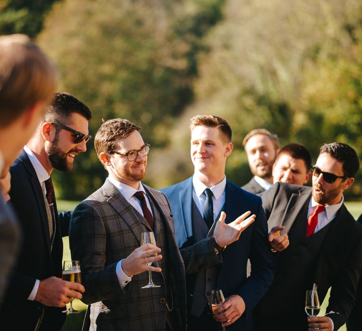 Groom in Check Christopher Schafer Clothier Suit Surrounded by his Groomsmen