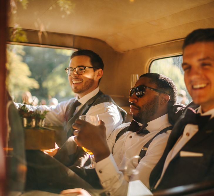 Groomsmen arriving in Vintage Wedding Car