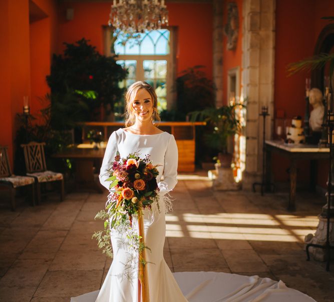 Bride in Minimalist Pronovias Wedding Dress with Front Split