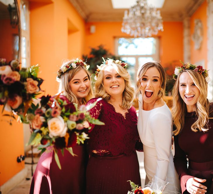 Bride in Pronovias Wedding Dress and Bridesmaids in Burgundy Dresses