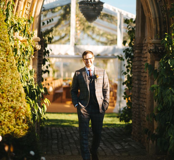 Groom in Christopher Schafer Clothier Check Suit Waiting for a First Look of His Bride