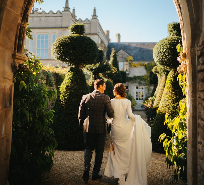 Bride in Pronovias Wedding Dress and Groom in Checked Suit