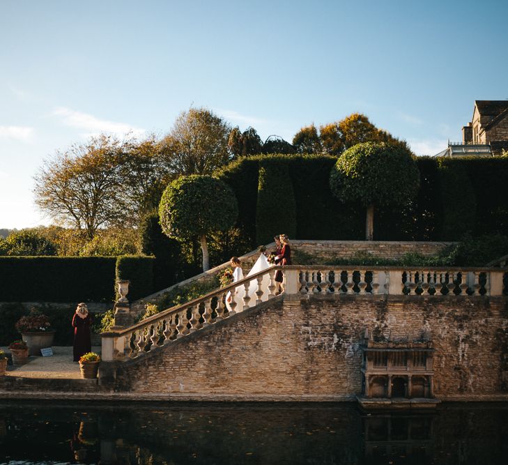 Bridal Party Walking Through The Gardens of The Lost Orangery at Euridge Manor