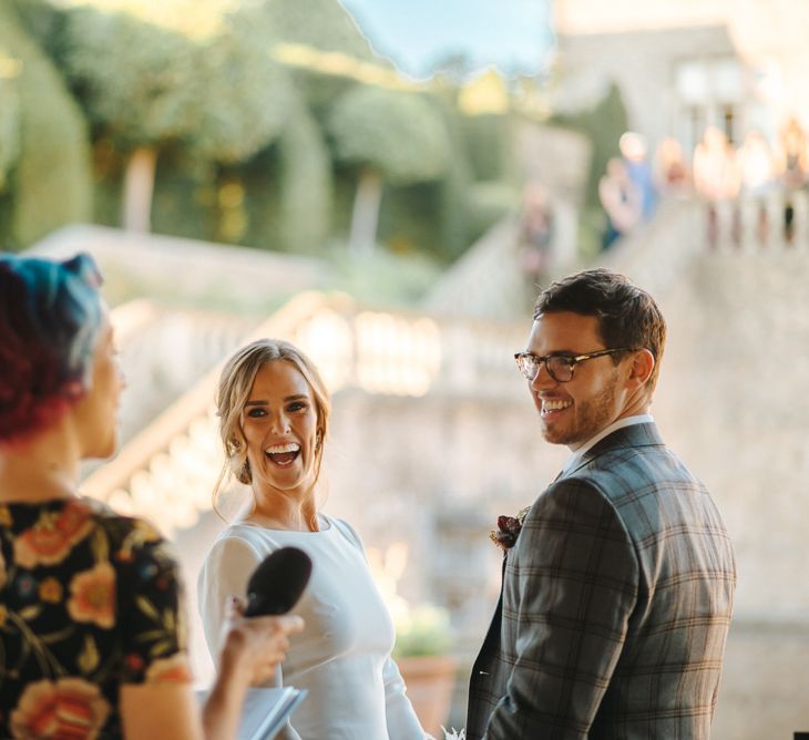 Bride and Groom Laughing During Outdoor Wedding Ceremony at Euridge Manor