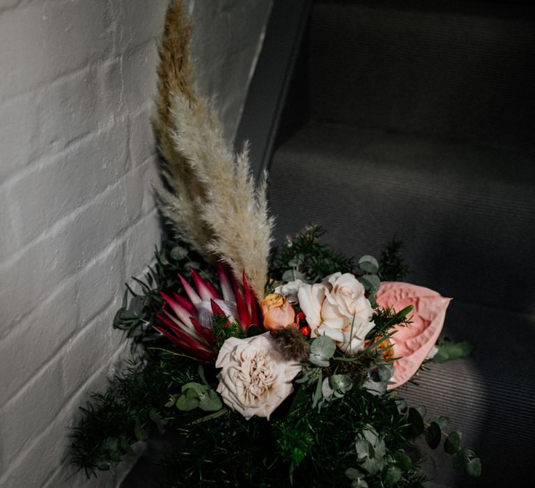 Boho wedding bouquet with king protea, pampas grass and anthuriums