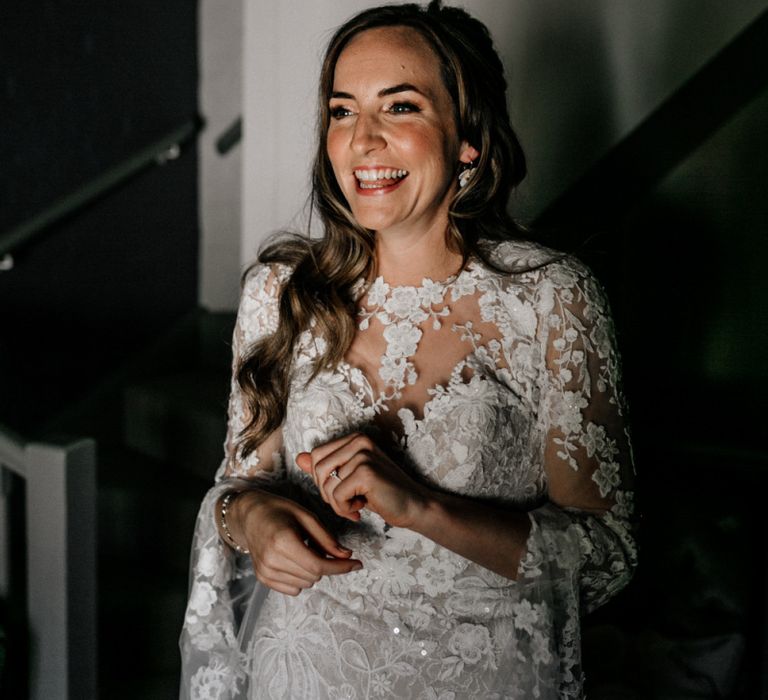 Happy bride on wedding morning in lace wedding dress