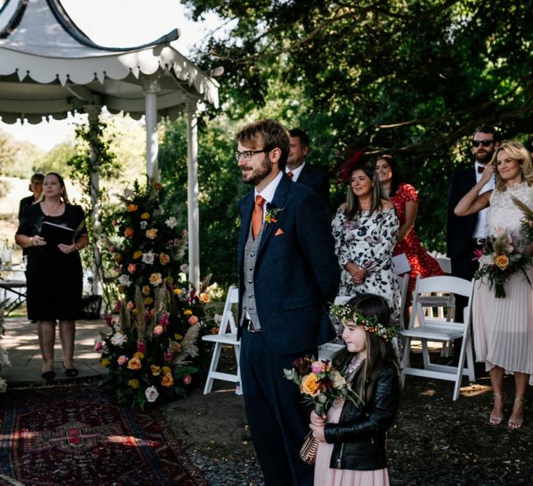 Groom and Flower Girl waiting at the Altar of the outdoor Preston Court wedding ceremony