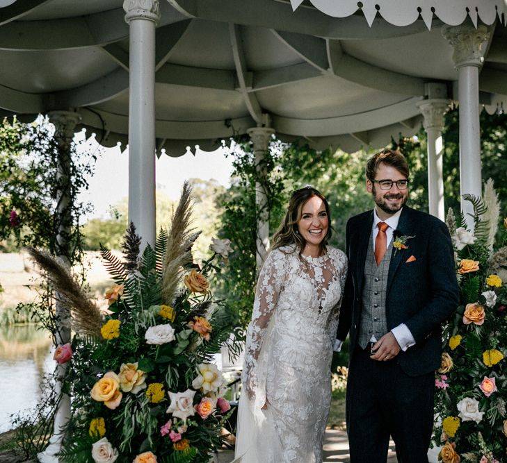 bride and groom just married at outdoor wedding ceremony