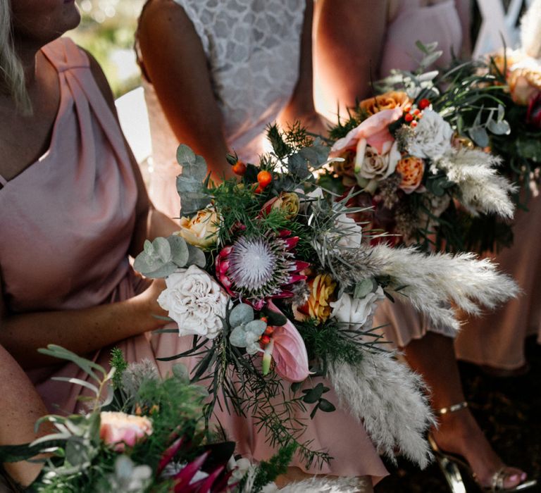 Bridesmaids Bouquets with pampas grass, roses and king proteas