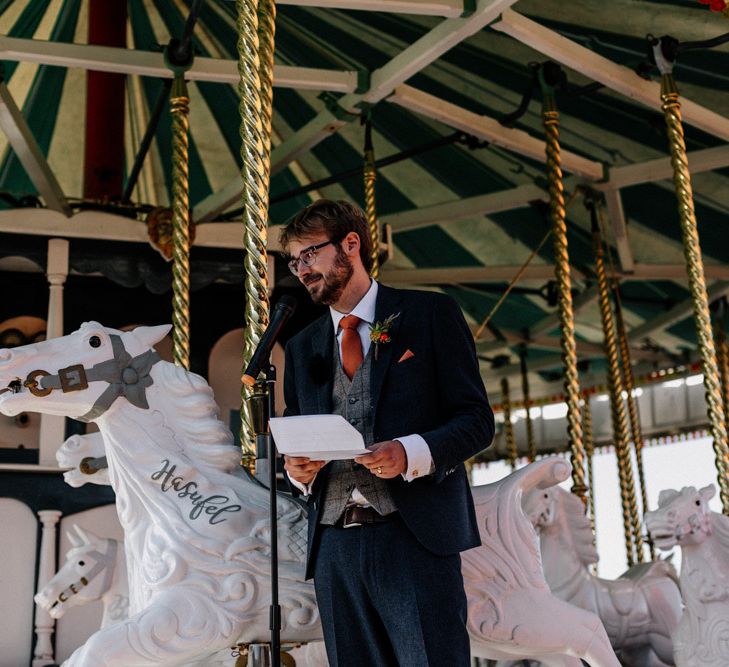 Groom in Navy suit and check waistcoat giving his speech