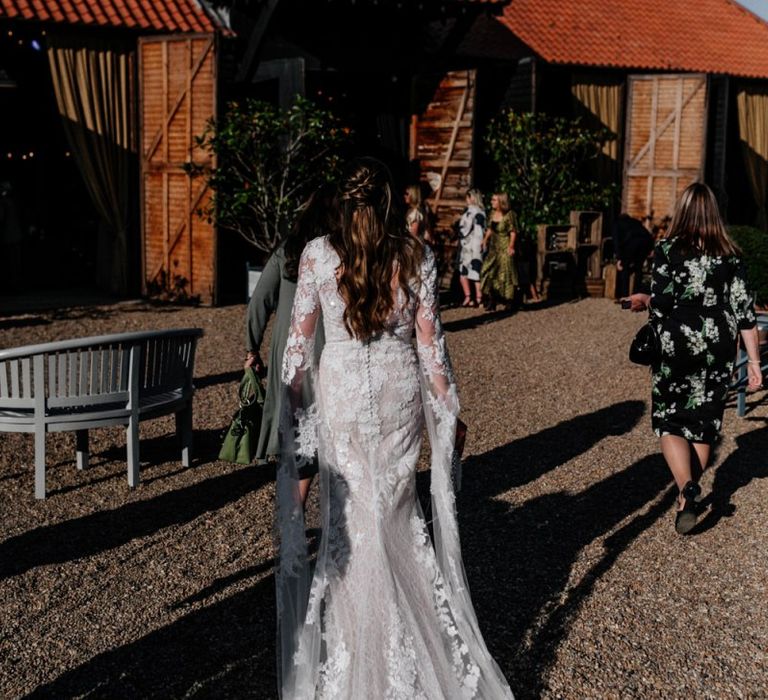 Bride in Pronovias wedding dress with Half up half down wedding hair