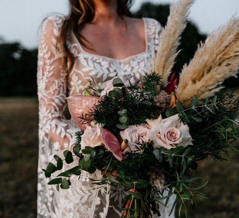 Wedding bouquet with pampas grass, anthuriums and roses