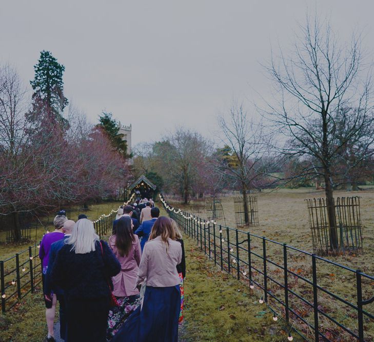 Wedding guests walking to the church for South Farm wedding