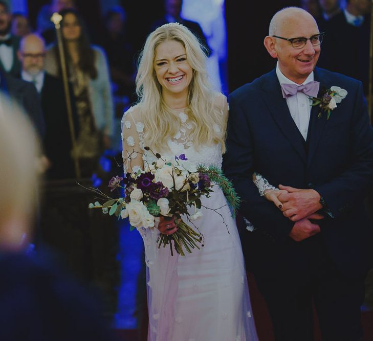 Bride walking down the aisle in Rime Arodaky wedding dress