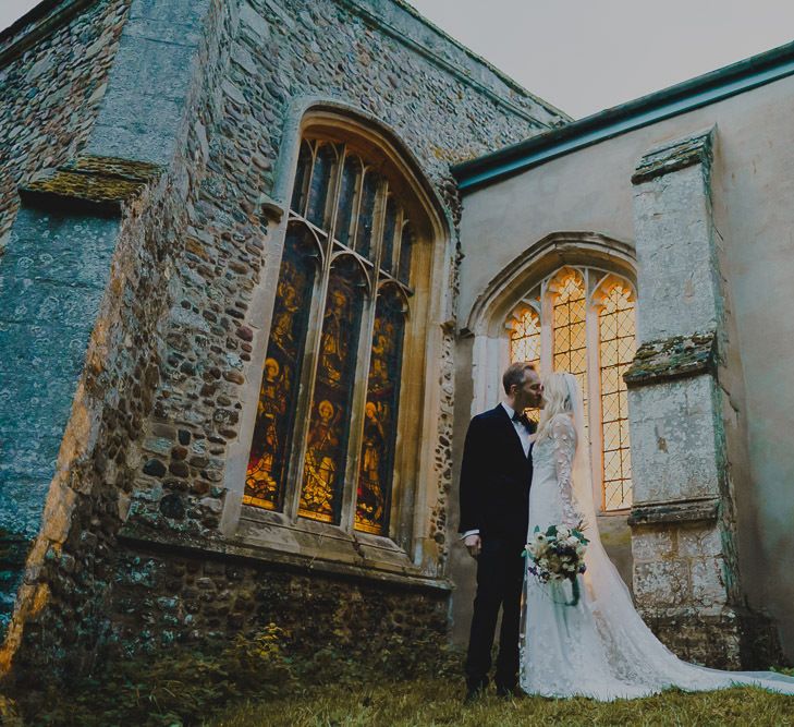 Bride and groom portrait outside the church at South Farm wedding