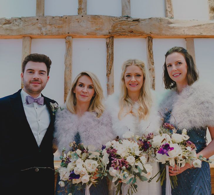 Bridal Party in green dresses and faux fur coverups