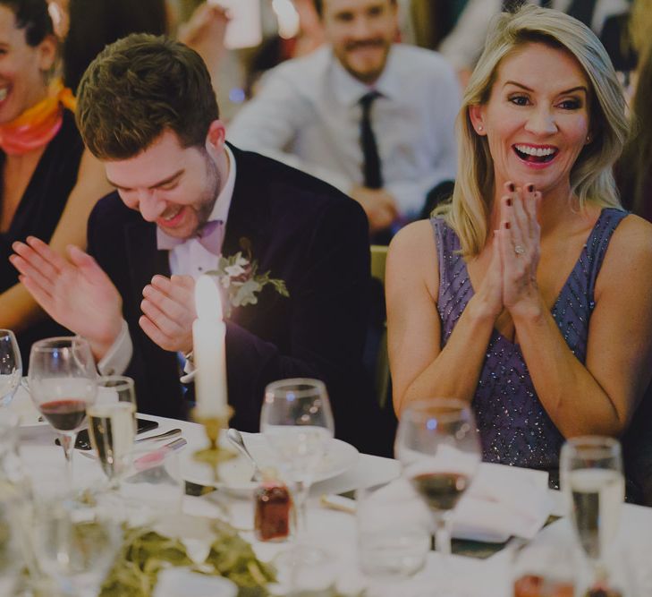 Wedding guests clapping during the reception speeches at South Farm