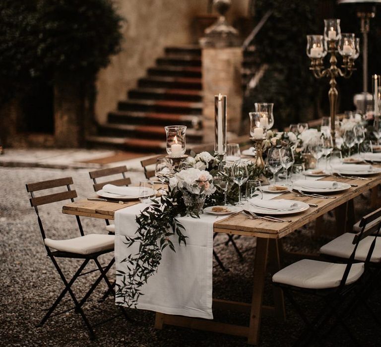 White wedding flower table decor with candelabras