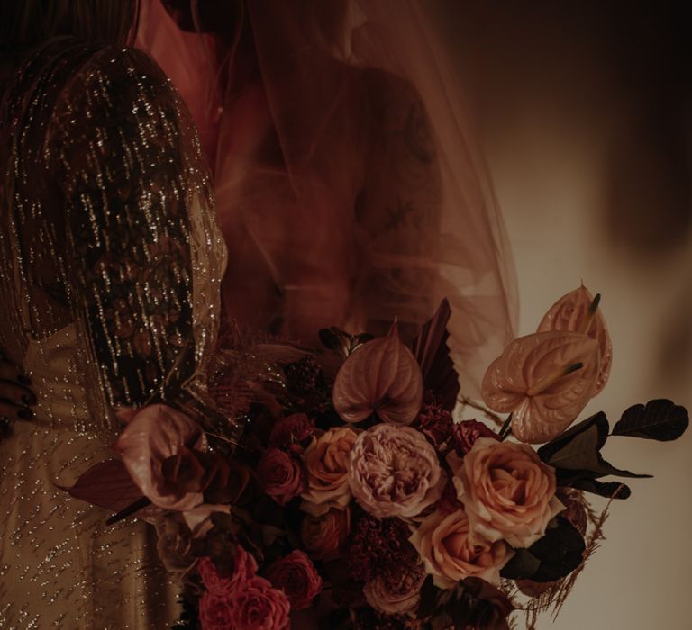 Pink wedding bouquet with roses and anthuriums