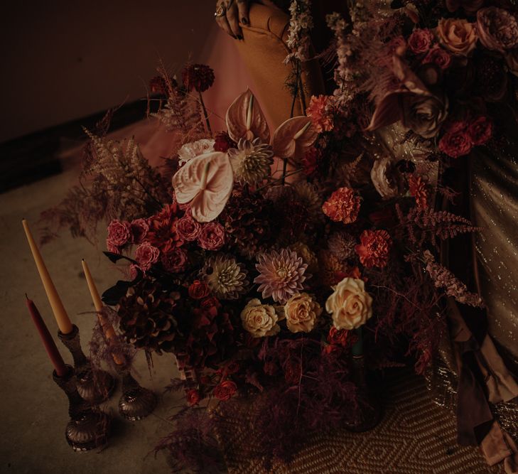 Pink wedding flower arrangement with dahlias and anthuriums