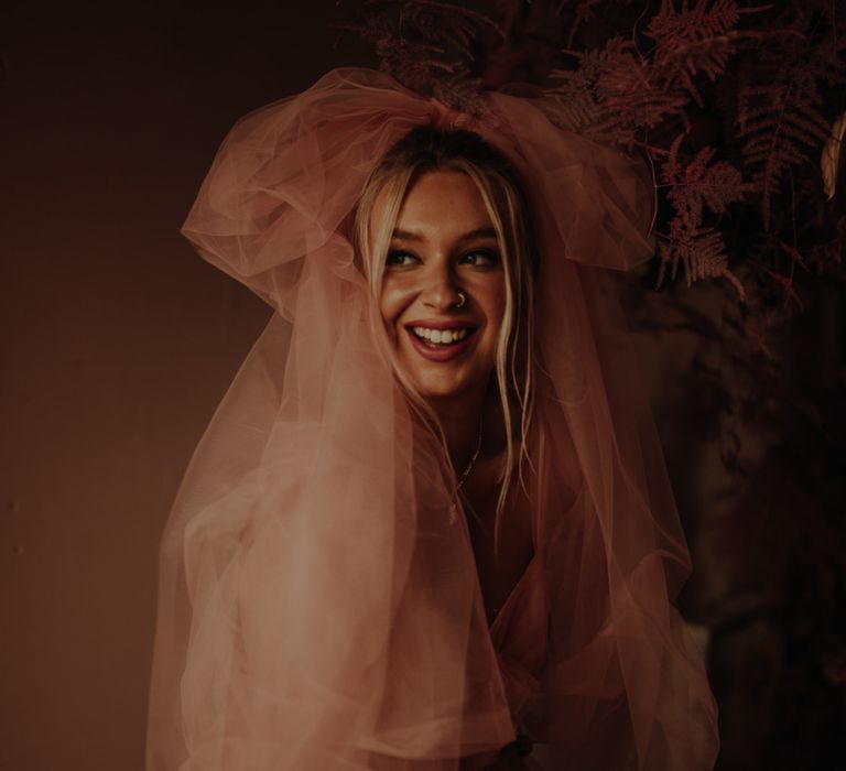 Bride in pink dress for wedding inspiration at The Giraffe Shed