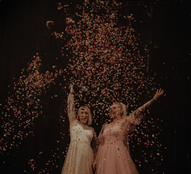 Confetti explosion with bride in pink dress for wedding inspiration at The Giraffe Shed