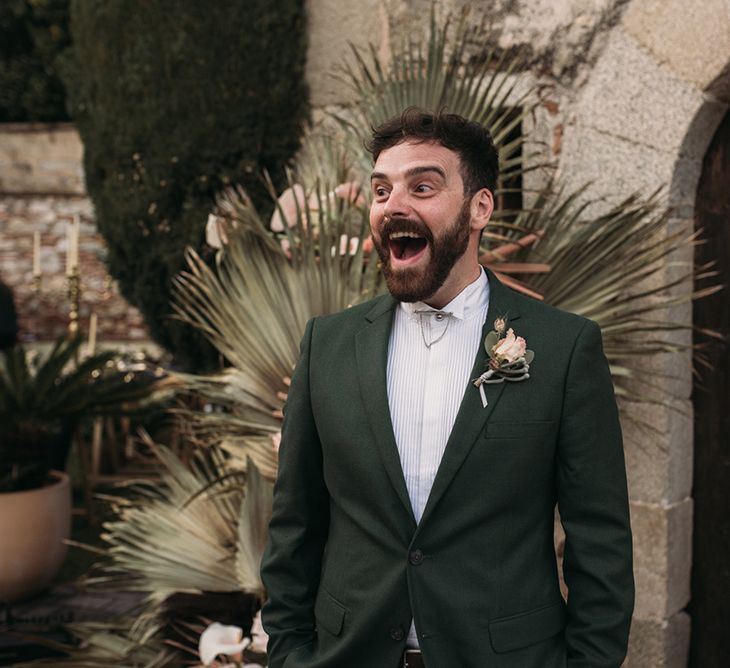 Surprised Groom at the Altar in a Forest Green Wedding Suit