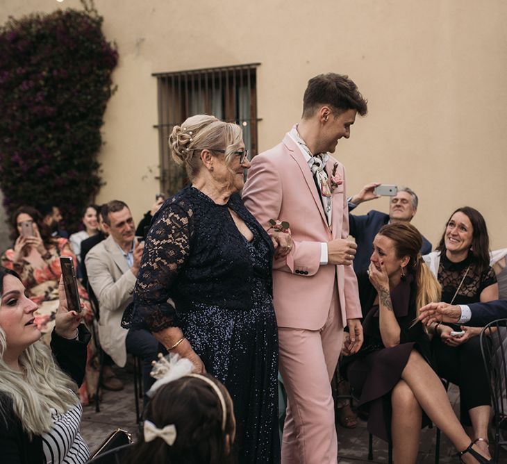 Wedding Ceremony Grooms Entrance with Groom in Pink Wedding Suit and Neck Tie