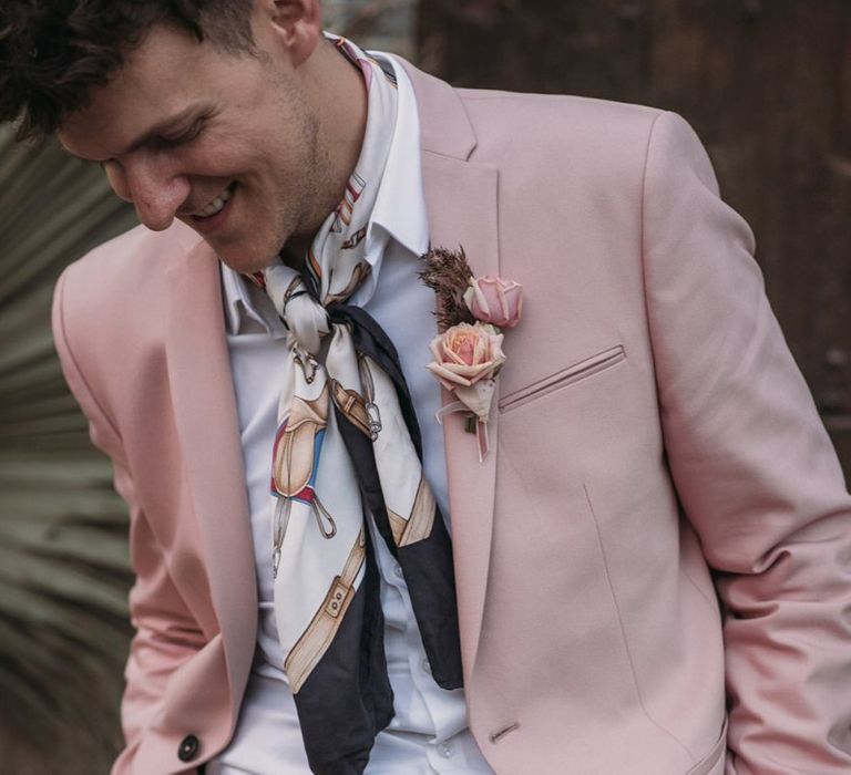 Groom in Blush Pink Wedding Suit with Neck Tie