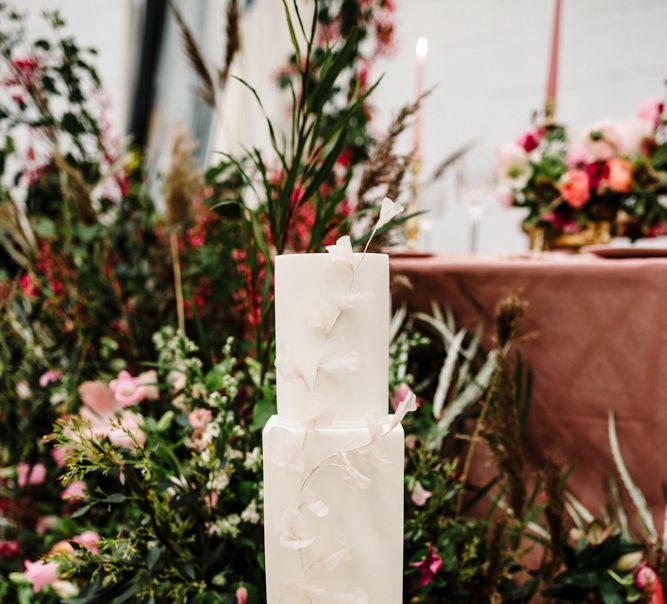 Tall Wedding Cake with Floral Skirt and Front Decor