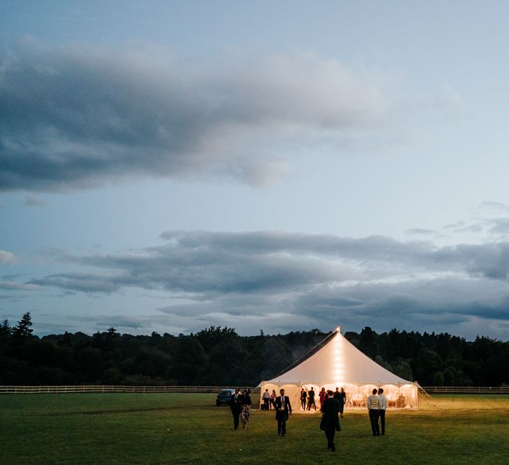 Marquee during dusk as the moon illuminates the sky at Hawarden Castle in Wales