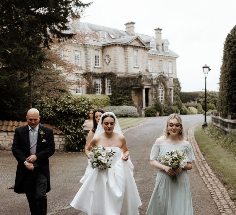 Bridal Party Make Their Way To The Church Ceremony