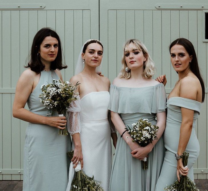 Bride In Strapless Wedding Dress With Blue Bridesmaid Dresses