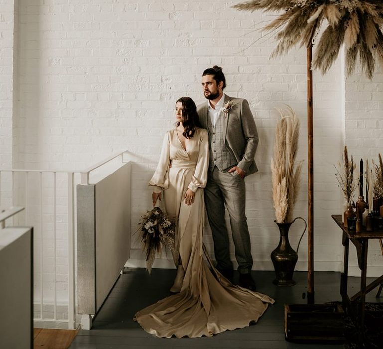 Stylish Bride in Oyster Coloured Wedding Dress and Groom Beige Wool Suit