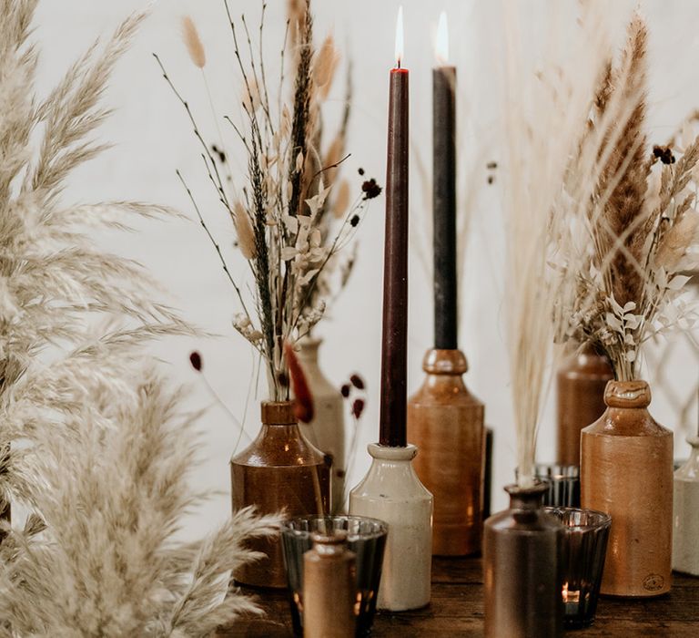 Ink Bottles Filled with Dried Grasses and Taper Candles