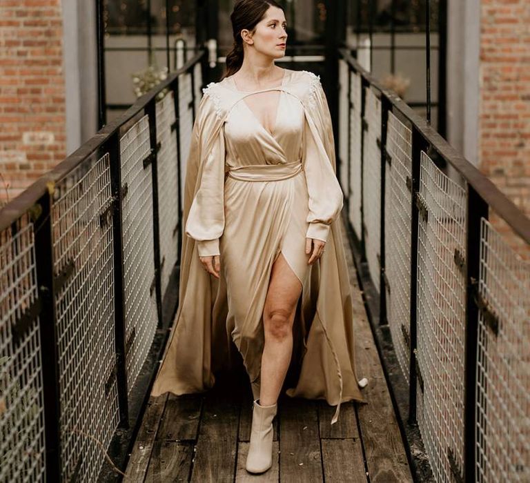 Stylish Bride in Gold Satin Wedding Dress with Matching Cape and Bridal Boots