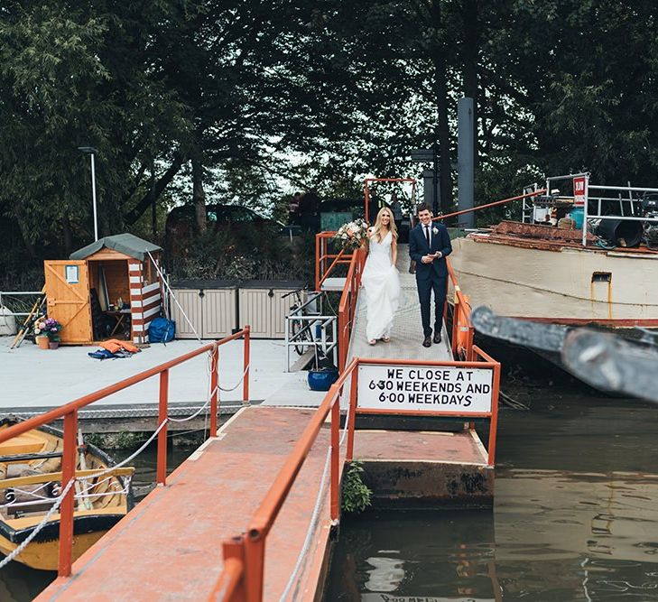 Bride and Groom Boarding Boat to Reception