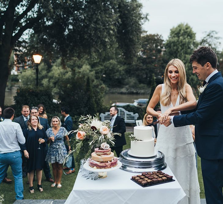 Bride and Groom Cutting Cake Portrait