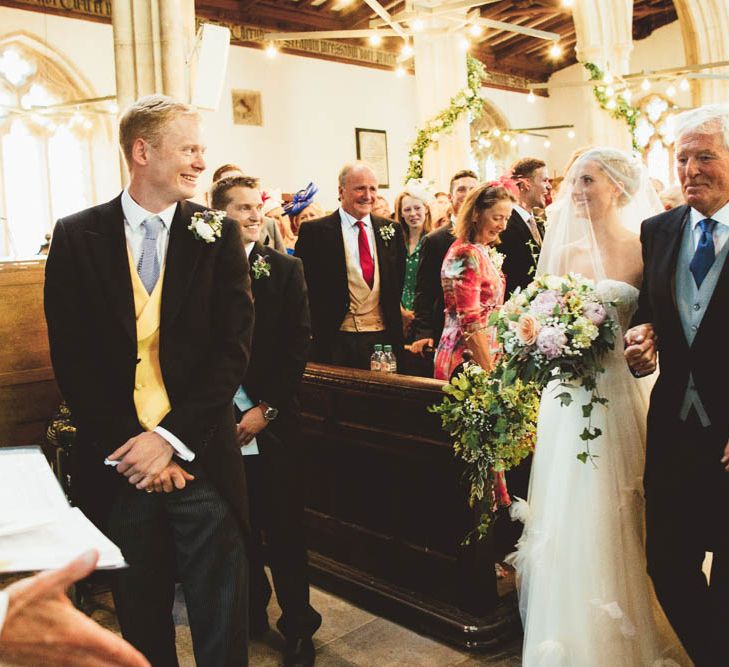 Bride in Halfpenny London Wedding Dress meeting Her Groom at the Altar